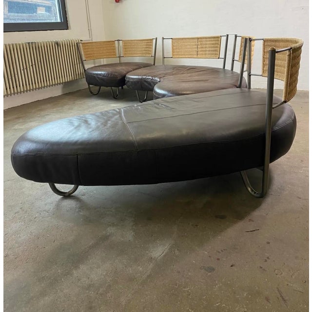 Sectional sofa by kurt beier design: 1989 brown leather, metal backrest with sisal rope the sofa consists of three...