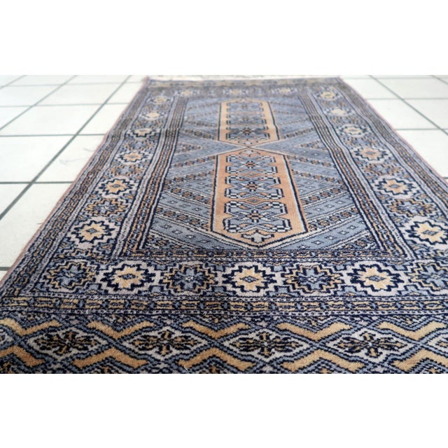 Classic Bukhara Weaving from Central Asia This handmade vintage Uzbek Bukhara rug dates to the 1950s and reflects the rich...