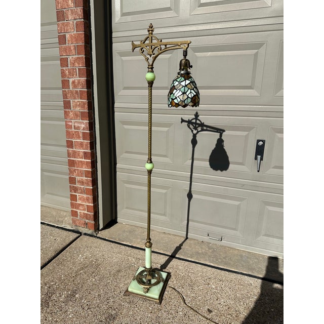 Antique art deco jadeite cast iron floor lamp. This spectacular 1920s beauty has green uranium glass with a caramel swirl...
