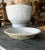This is a vintage graniteware pie pan with a crackled paint effect on the underside. It measures 9.5"DIAM x 1.5"H. The...