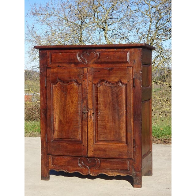 A very old wedding sideboard, entirely in solid walnut, traditionally made in France at the end of the 18th century....