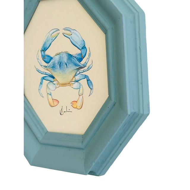 A charming hand-painted blue crab artwork, created with beautiful attention to detail by our master artists. Painted using...