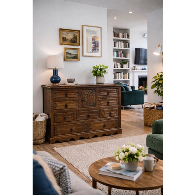 A striking antique Black Forest carved oak chest of drawers, beautifully crafted and rich in character, featuring...