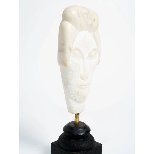 Asian marble bust sculpture on wood base.