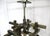 An exceptional bronze toned square tubed metal City Scape chandelier in a cubist style with ten light sockets that can...