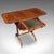 This is an antique drop leaf ladies work table. An English, mahogany sewing or writing table, dating to the Regency...