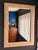 Tessellated fossil coral and pink stone wall mirror with brass trim in the manner of Maitland Smith. Can be hang vertical...