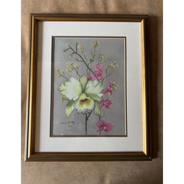 A charming vintage pair of framed botanical floral pastel artworks by Claire Reilly, signed and dated 1986. Executed in...