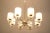 This vintage chandelier was made in the 1970s in Austria. It features a brass construction with glass lamp shades. The...