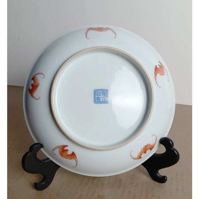 Chinese porcelain double fenghuangs bowl, with an imperial yellow glaze covered with fine iron wire craquelure on the...