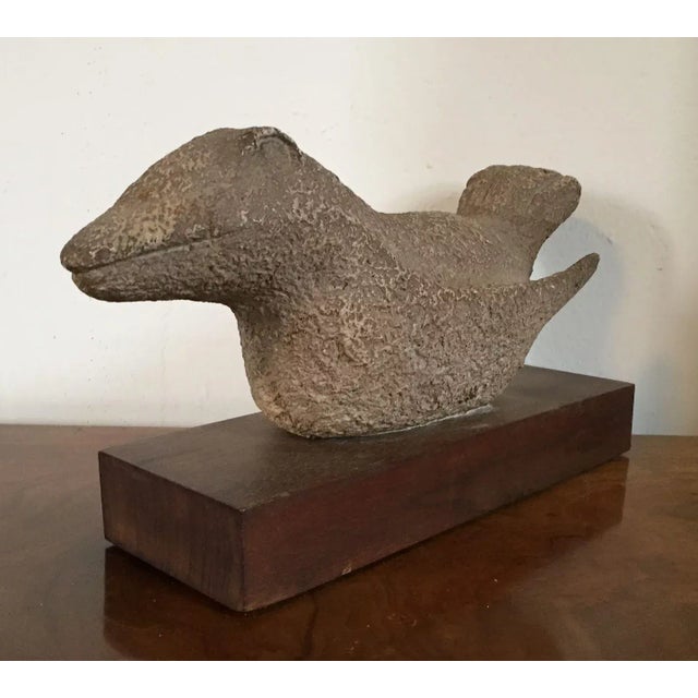 Modernist ceramic bird sculpture mounted on a wood base. Highly stylized with expressive facial features and textured...