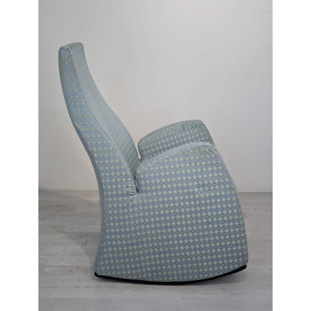 Stylish upholstered armchair with a high, comfortable backrest and armrests. Upholstered in a decorative light blue fabric...