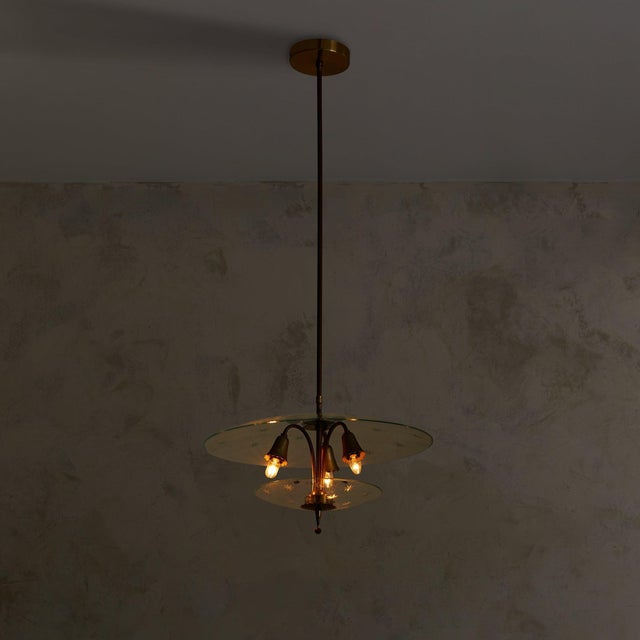 A lyrical composition in glass and brass, this 1940s chandelier is attributed to Pietro Chiesa for Fontana Arte. Suspended...