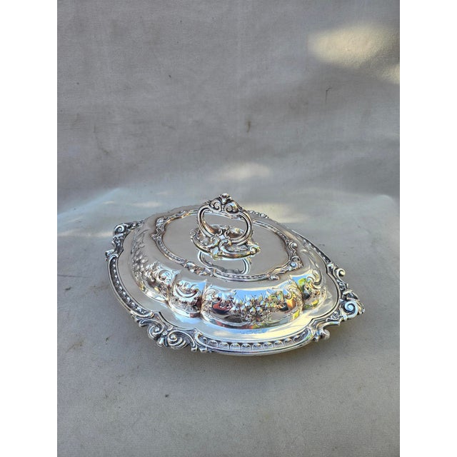 This is an exceptionally beautiful ornate serving dish with lid. The embossed pattern is unique and the details are...