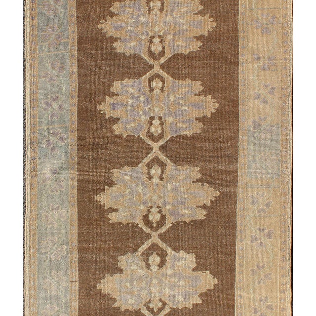 Measures: 3'3 x 8'11. Turkish Oushak Runner with Soft Blue and Cream Accents on a Warm Mocha Field. Keivan Woven Arts /...