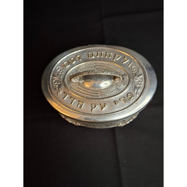 Offered here is an early-to-mid 20th-century silver-plated oval Etrog Box (Esrog container) designed for the holiday of...