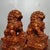 This is an exceptional pair of hand-carved wooden guardian lion statues, traditional symbols of protection, power, and...