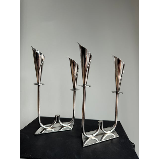 Pair of Hans Jensen Calla Lily double candlesticks in silver-plated metal, 1960s. Vintage pair of "Calla Lily" silver-...