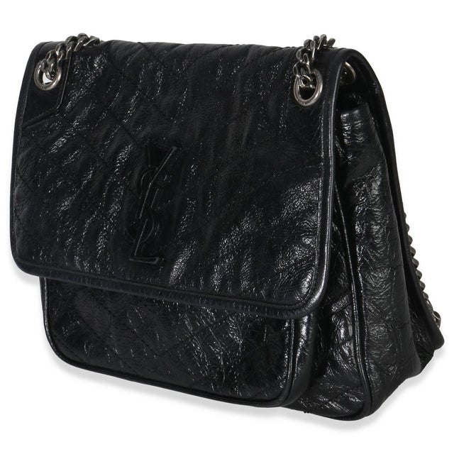 Item #: 153109 Exterior Material: Leather MSRP: 3,250 Interior Material: Fabric Size: Medium Features Interior: Two slip...
