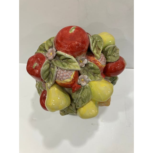 This hand painted terracotta fruit topiary features Pomegranates , lemons, pears & apples . 14 inches H 12 inches at the...