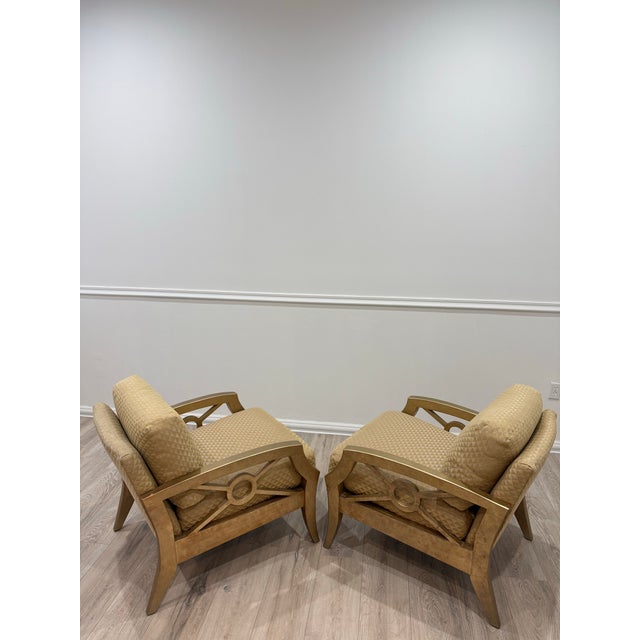 Judith Norman Collection Set of Two Armchairs in Gold finished frame. The seat and back are upholstered in a textured tan...