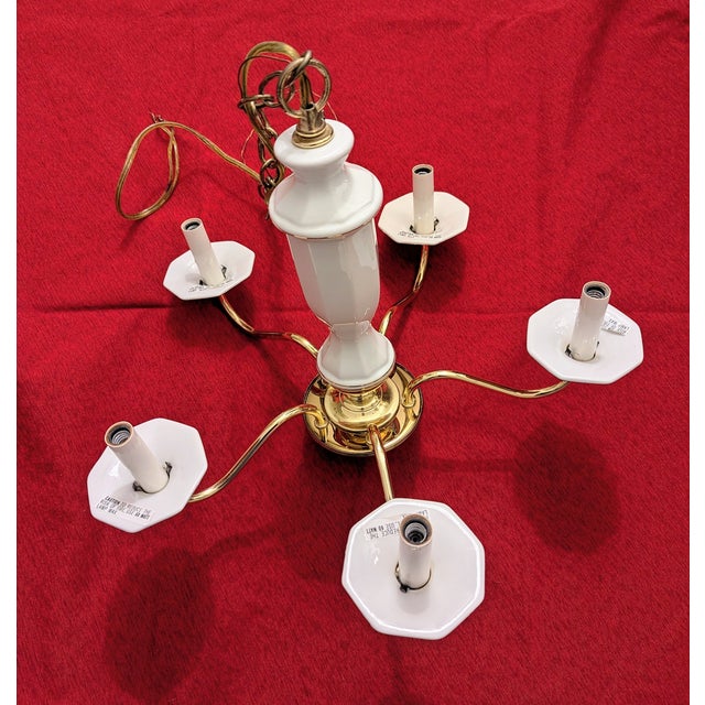 This 5-light vintage candelabra-style fixture is made of gorgeous bright white porcelain with delicate gold-tone trim....