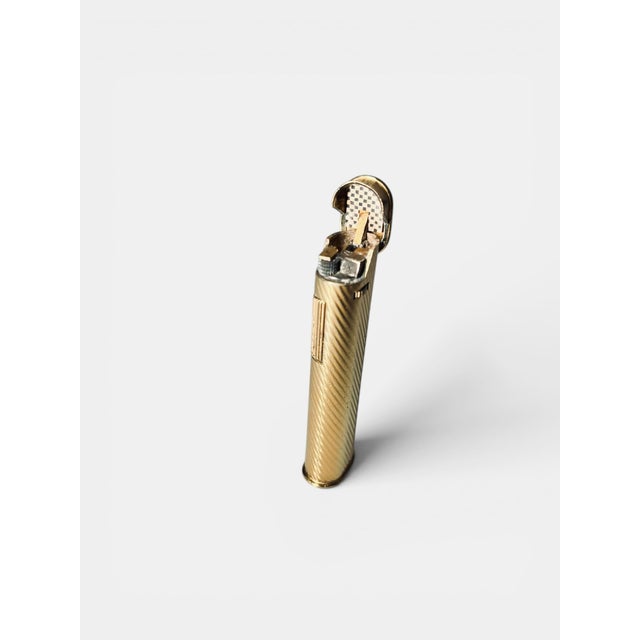 Gold-Plated Lighter from Dunhill, 1970s, in Very Good conditions. Designed 1970 to 1979 This piece has an attribution...