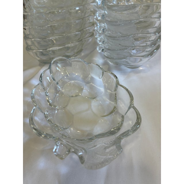 Set of 12 vintage pressed glass bowls featuring sculptural grape cluster forms and textured detailing. These charming...