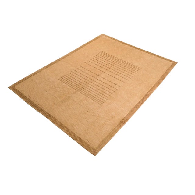 Made with a sheen in a beautiful color pallet, this Nepalese hand knotted rug is known for its soft pile, embodying the...