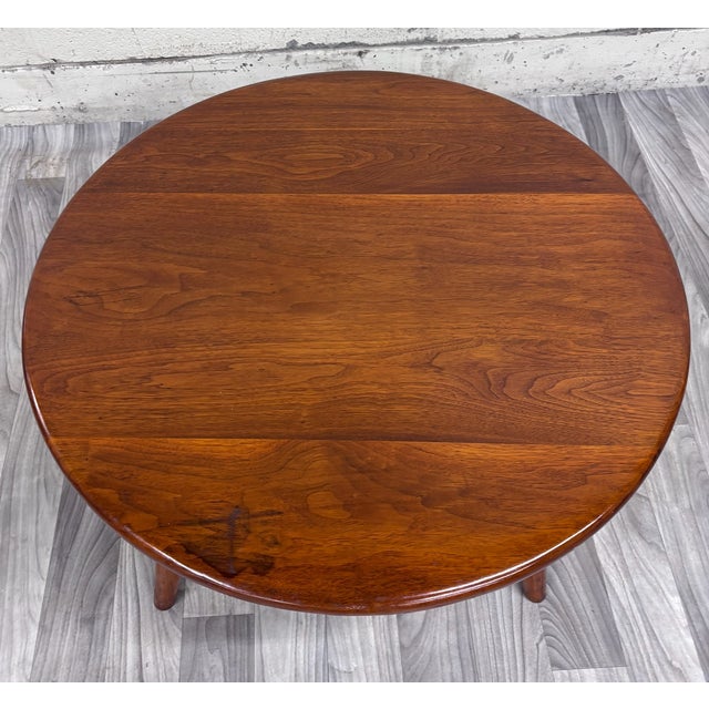 This is a beautiful vintage Mid-Century Modern round walnut coffee table dating to 1953. Featuring a richly grained...