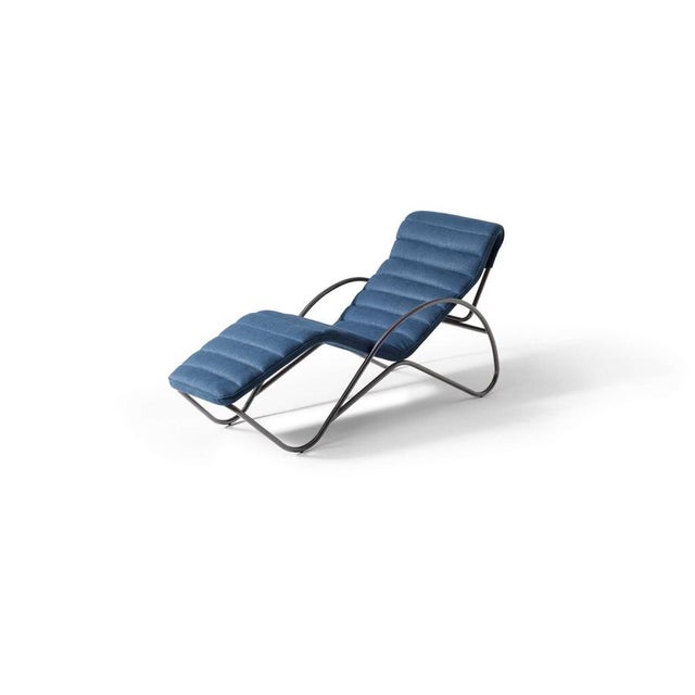 Charlotte perriand indochine blue chaise lounge manufactured by cassina a symphony of modern lines an iconic chaise longue...