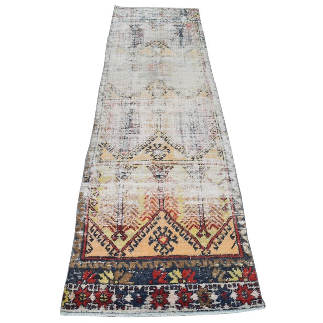 Hand-knotted with care using traditional rug-making techniques, this wool rug blends timeless craftsmanship with a modern...