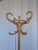 Vintage bentwood coat stand crafted from light wood (likely beech). The design features gracefully curved hooks and a...