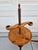 A pair of Colonial style adjustable floor candle stands; the stands feature a threaded central wooden shaft that allows...