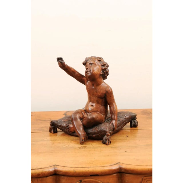 French 1780s Baroque Style Walnut Sculpture of Putto Sitting on a Pillow For Sale - Image 4 of 13