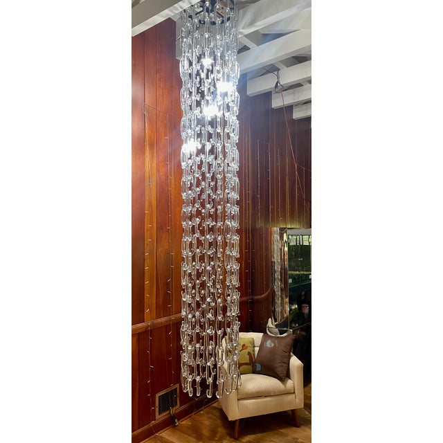 10 ft. chain link, hand blown, Murano glass chandelier in the style of Gino Vistosi. The Chandelier is modular and the...