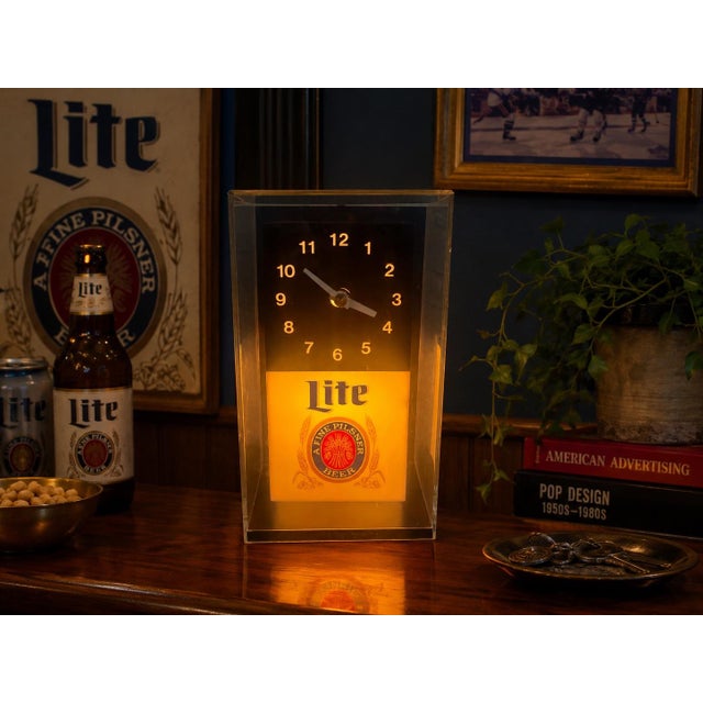 A wonderfully nostalgic piece of 1980s American breweriana, this vintage Miller Lite illuminated cube clock dates to March...