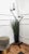 Beautiful Italian, in typical Mid-Century Art Deco style, two-armed floor lamp in black metal with brass details and...