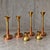 4 x Large / weighty postmodern candles / 1970s / two heights 60 - 70 cm / copper - brass Height 60 / 70 Width 23Depth 23...