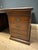 Beautiful antique partner desk in very good condition. The desk has a cabinet on each side and four drawers. It has a dark...