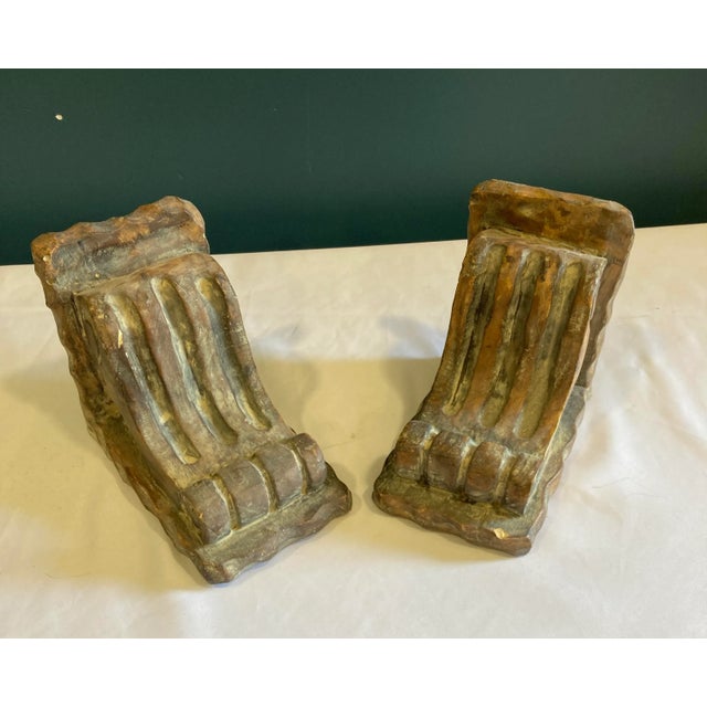 A sculptural pair of vintage ceramic bookends designed to resemble classical architectural column fragments. Finished in a...