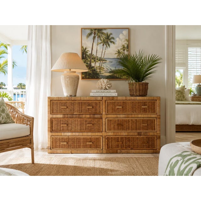 Beautiful vintage coastal dresser crafted in natural rattan and woven wicker, featuring six spacious drawers with...
