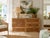 Beautiful vintage coastal dresser crafted in natural rattan and woven wicker, featuring six spacious drawers with...