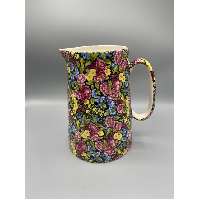 Beautiful vintage Crown Staffordshire porcelain pitcher featuring an elegant floral design with delicate decorative...