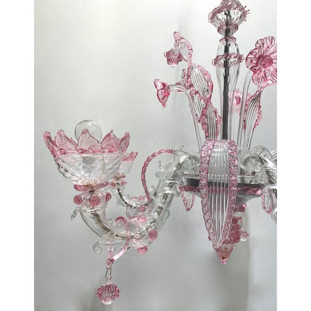 Chandelier attributed to the a.v.e.m. Company it has a beautiful transparent rose colored glass very scenic, and rare to...