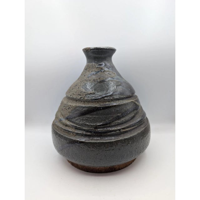 This vintage Mid Century Studio Pottery Multi Textured Speckled Stoneware Vase is a beautifully crafted piece of American...