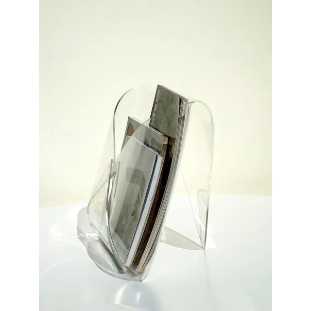 This magazine holder in an envelope shape is made from transparent Acrylic Glass.