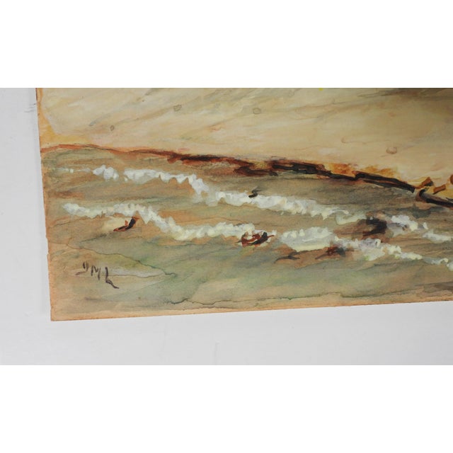 Early 20th century watercolor on paper of coastal cabin with old lobster traps outside. Signed GML lower left corner....