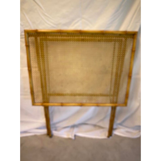 Vintage Collapsible Metal Faux Bamboo Tray Table with a Faux Cane Top. It maintains it's original paint. It collapses to...