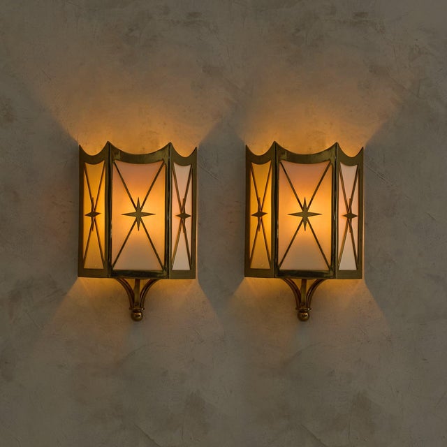 A pair of French sconces from the 1950s, with radiating brass detailing often seen in Riviera interiors from the period....